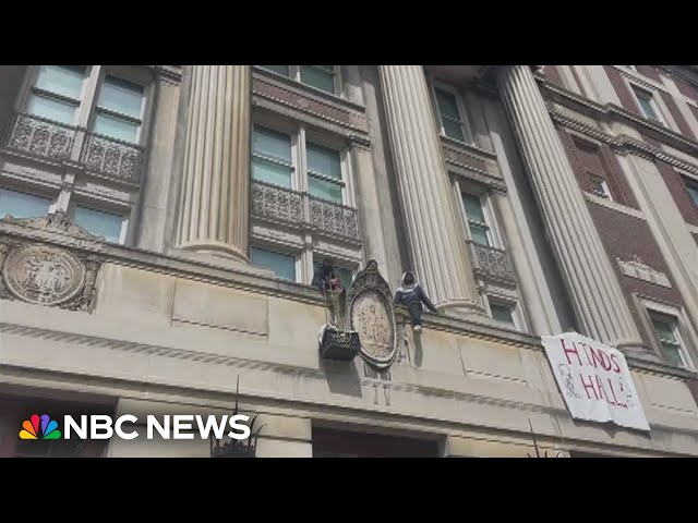 Protesters lift supplies into Columbia's barricaded Hamilton Hall