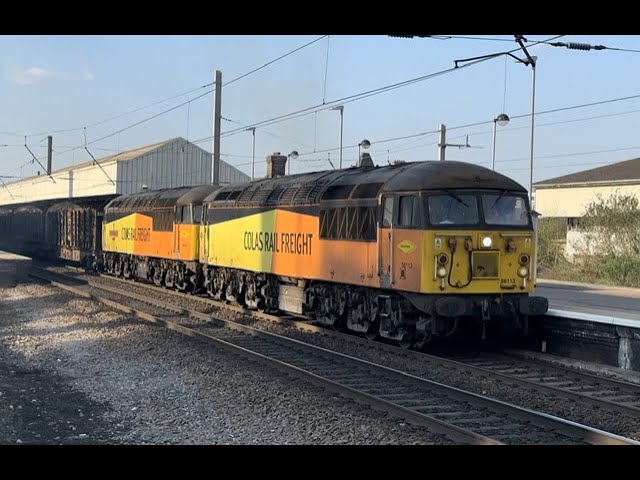 Variety of trains At Warrington Bank Q ( includes a pair of class 56s on the log train )