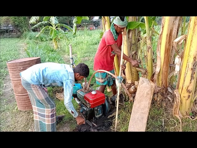 Two skill farmer try to lifting water by 5hp diesel engine water pump. 5hp engine start process.