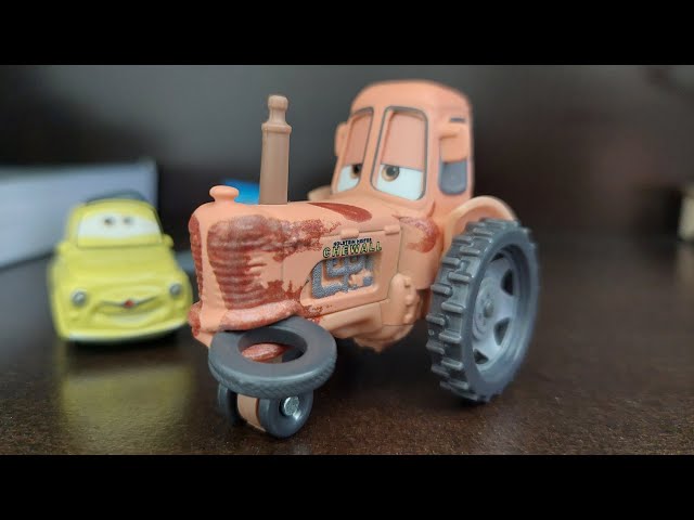 Tractor with tire in mouth Score n Review