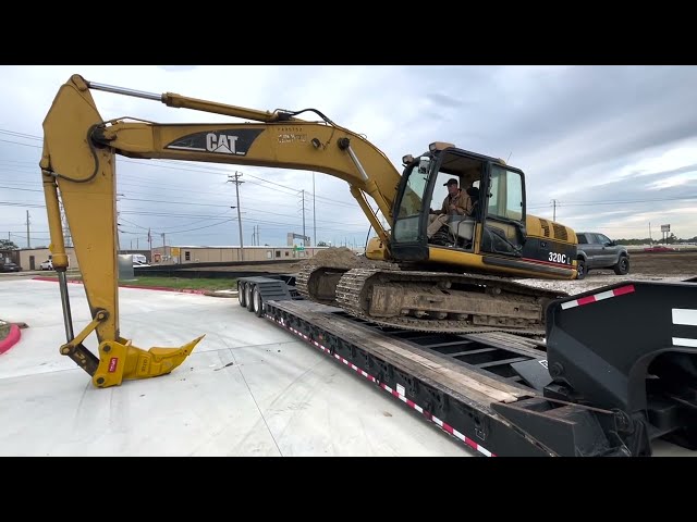 Side loading the 320  Cat excavator on the RGN trailer