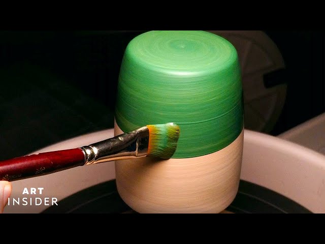 Ceramist Evenly Paints Designs Onto Spinning Pottery