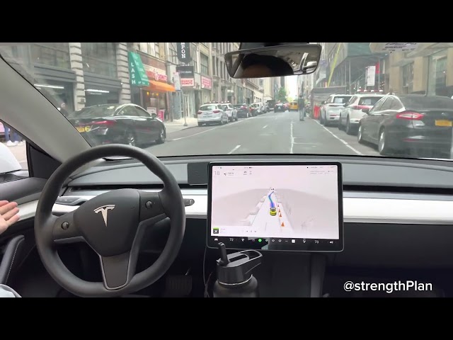Tesla waits for pedestrians and navigates around random guy in street