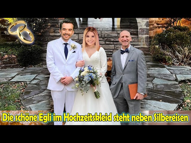 Die schöne Beatrice Egli im Hochzeitskleid steht neben Florian Silbereisen