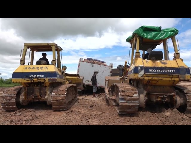 Two Komatsu Bulldozers try pulling Dump truck stuck wetland |​​ Machine Kh