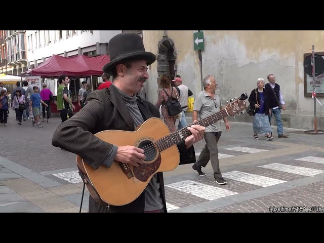 Street Music Guitarist in Italy. Great Music and Picturesque Performer