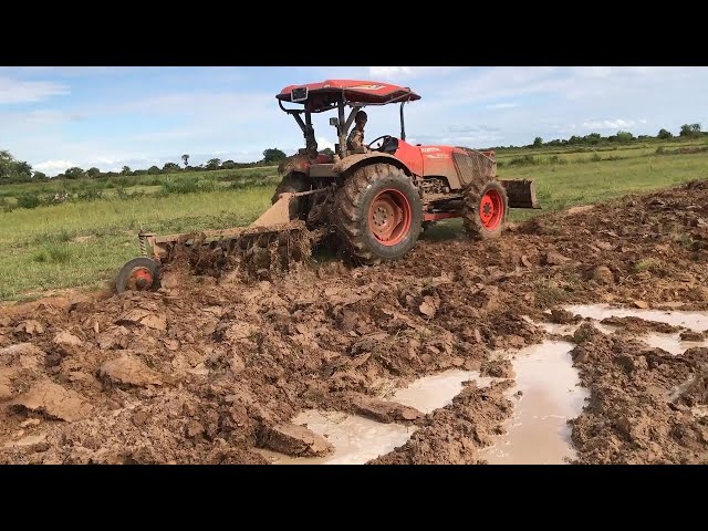 Tractor Kubota M6040SU Rice Plow​​ in my village