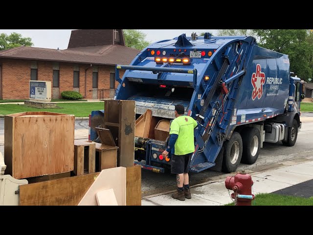 Republic Rear Loader Garbage Truck Packing Massive Wood Furniture Pile