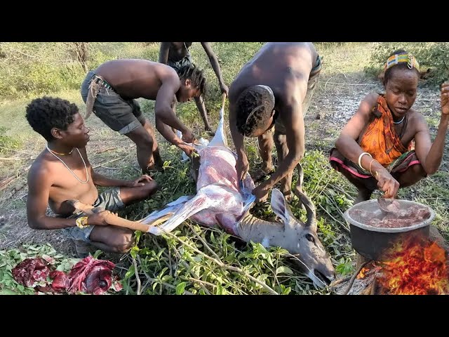 Hadzabe hunter gather community in African Tanzania. hunting cooking.