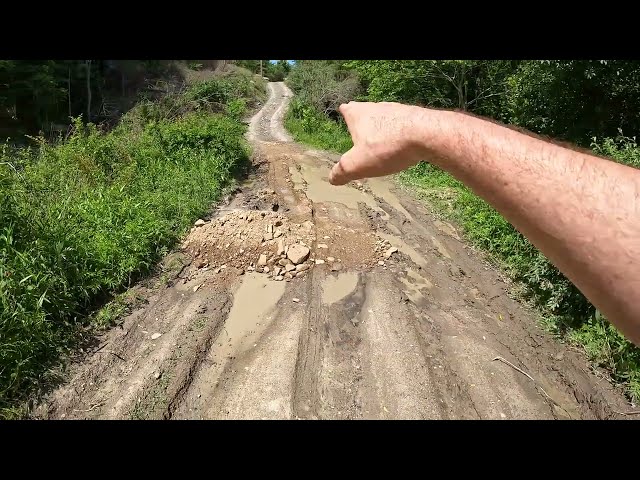 Fixing a muddy driveway with the mini excavator and tractor