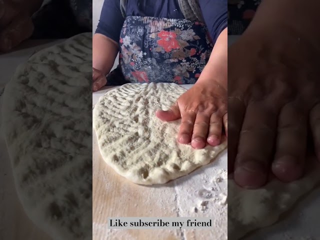 handmade pita bread on wood fire