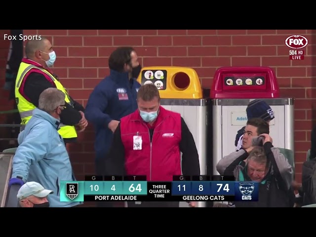 AFL coach Chris Scott exchanges words with a spectator