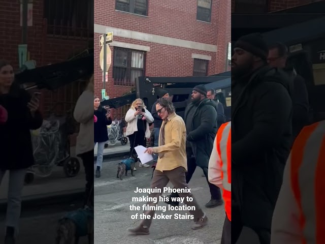 Joaquin Phoenix walking to filming location of Joker 2