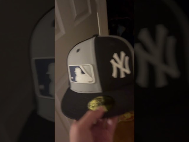 Yankees hat with mlb logo next to it