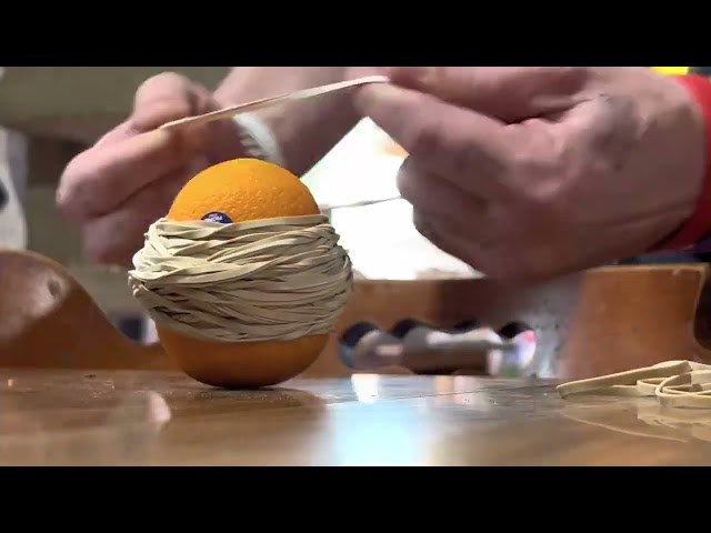 Exploding Orange! How many Rubber Bands Does It Take?!?