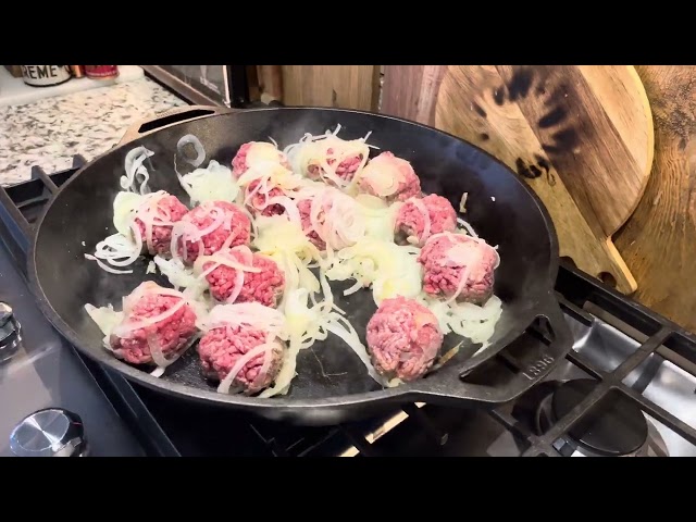 My wife making amazing, soon to be smash burgers with caramelized onions.  They were so so good!