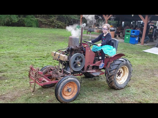 Tractor with hit miss engine
