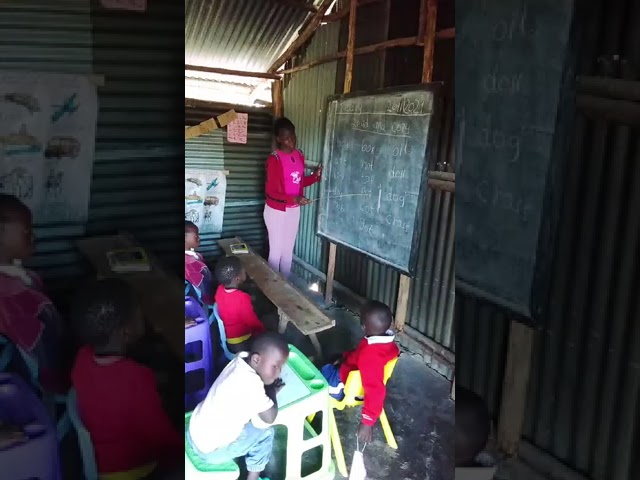 Talented Children of Grace Kenya School. Madam Lilian Angela teaching.