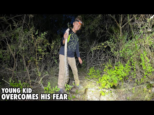 Young Kid Overcomes His Fear And Catches His First Python