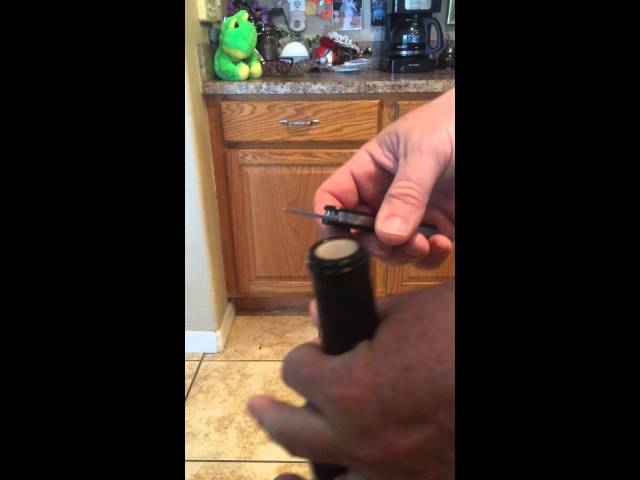 Open wine bottle using Swiss Army Knife with no corkscrew.