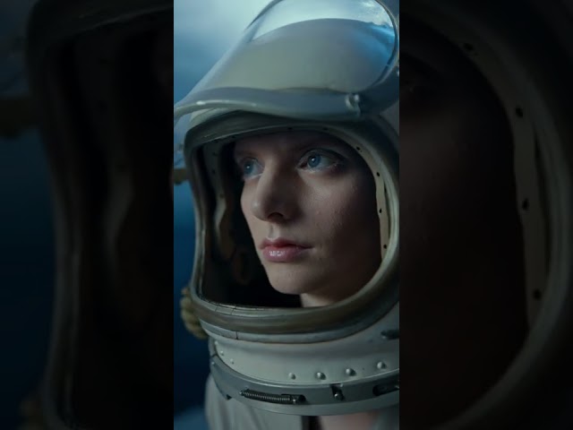 A Woman Wearing A Space Helmet