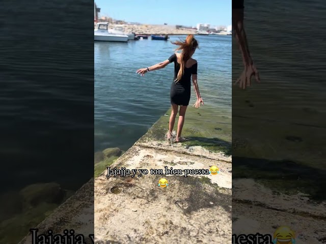 Woman Slips and Falls While Walking Into Water - 1506527