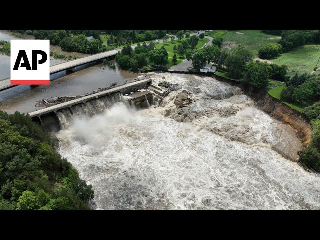 Minnesota dam still standing after floodwaters overcame parts of structure