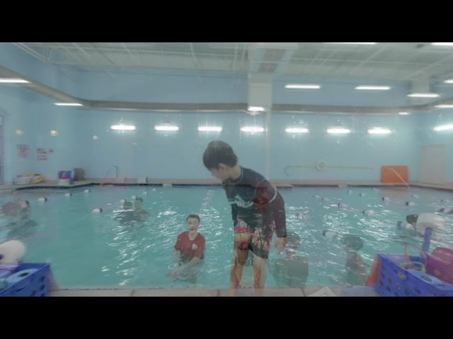 Twins learning to swim at Water Champs swim school