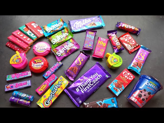 100 candies opening, chocolate a video, lots of chocolates, Cadbury celebration, surprise toys