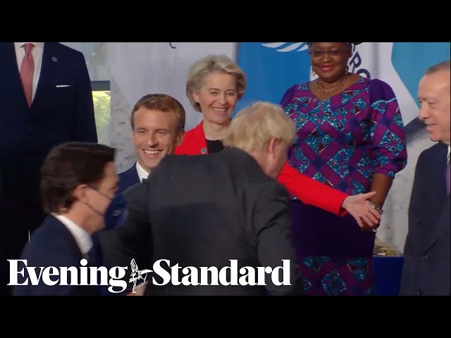 G20 leaders laugh as Boris Johnson arrives late to summit photo