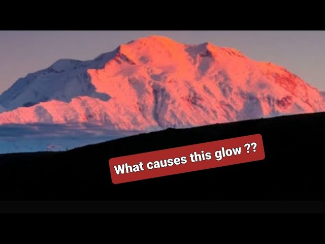 Why do some mountains have this reddish orange glow on them sometimes ?