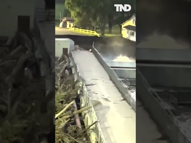 House collapses into river near failing dam