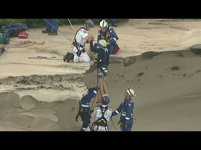 Dramatic moment two men are rescued after falling from cliff in Australia