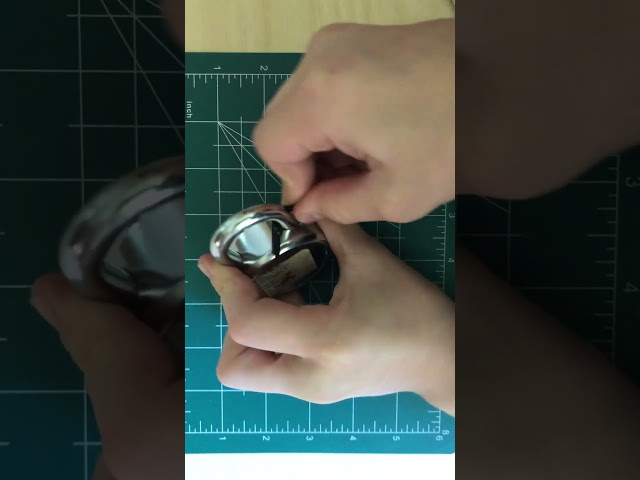 Opening a padlock with a shim