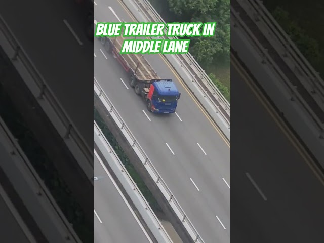 blue trailer truck in middle lane #everyone #automobile #truck #highlights #shortvideo #vlog #cars