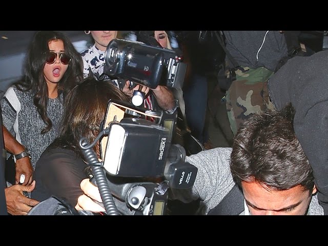 Photographers Trip Over Selena Gomez At LAX