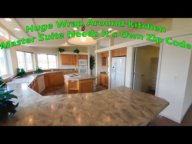 Huge wrap around kitchen (over 2700sf) Master bedroom area is larger than an entire single wide.