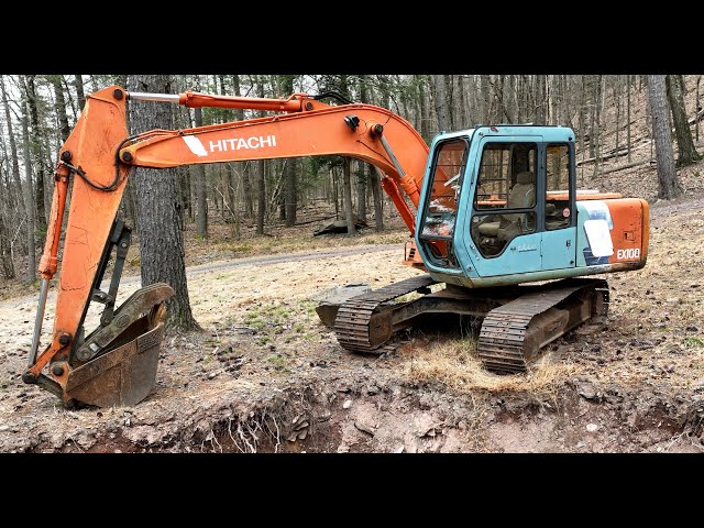 Excavator and driveway maintenance