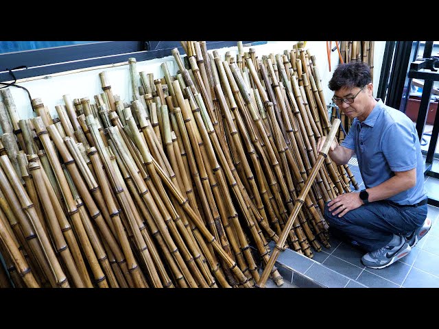 Process of making long bamboo flutes. Korean traditional musical wind instruments factory