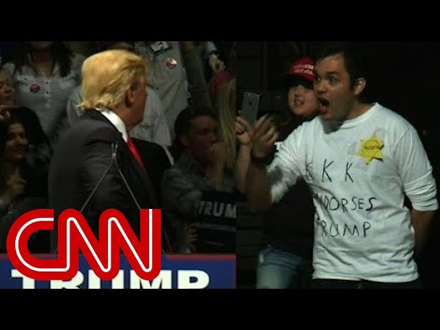 Trump stares down man in 'KKK' shirt