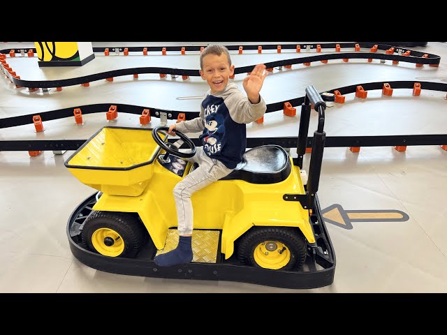 Sofia and Max Play at the Children's center and ride a Toy Tractor