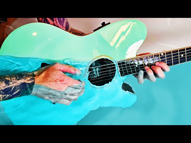 Playing guitar underwater actually sounds HEAVENLY