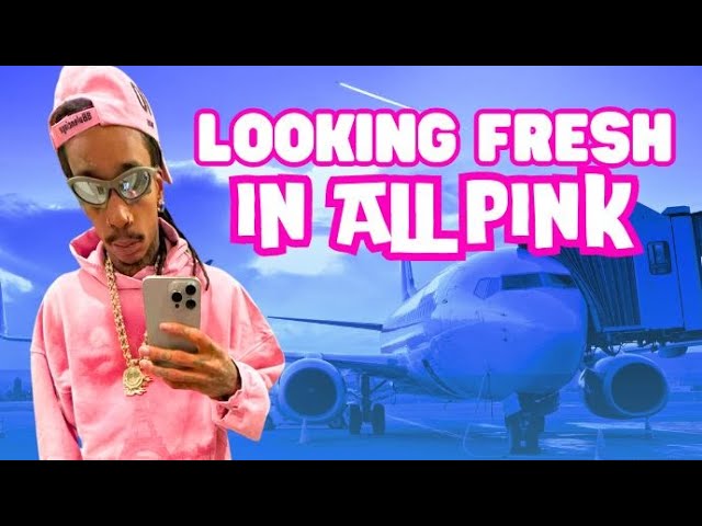 Wiz Khalifa Makes A Statement In Bright Pink Sweatsuit At LAX
