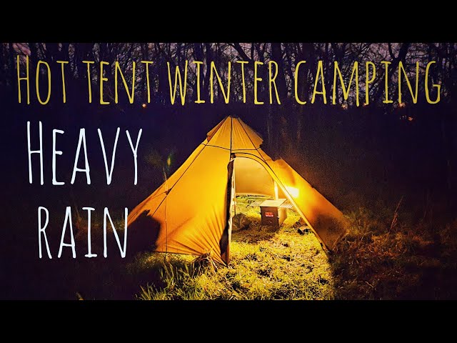 Hot tent winter camping using my onetigris iron wall stove tent and the outbacker stove, heavy rain