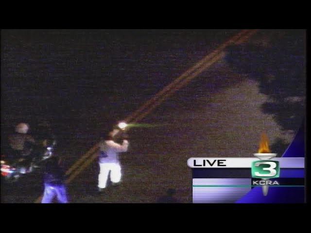 KCRA 3's Del Rodgers runs in the 2002 Olympic torch relay in Sacramento
