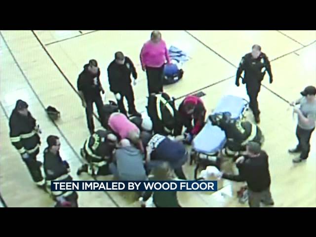 Girl playing basketball impaled by Middleton fieldhouse court