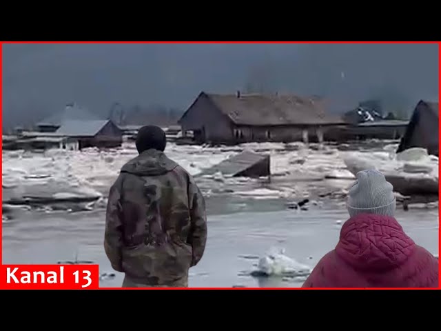 Residents in Russia's Kemerovo region show their flooded homes and yards