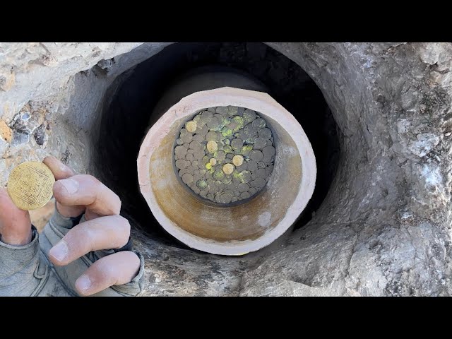 moment of finding big jar full of golden coins using a 3D metal detector