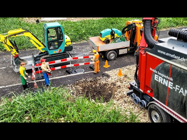 Sidewalk road repair, RC excavator Yanmar B37V, Suction excavator truck Erne Fant. Scania Truck