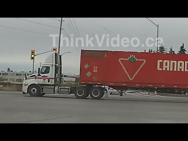 Close call - Canadian Tire truck runs red